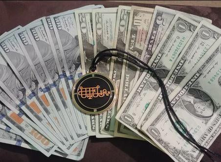 A Bune medallion on a pile of money