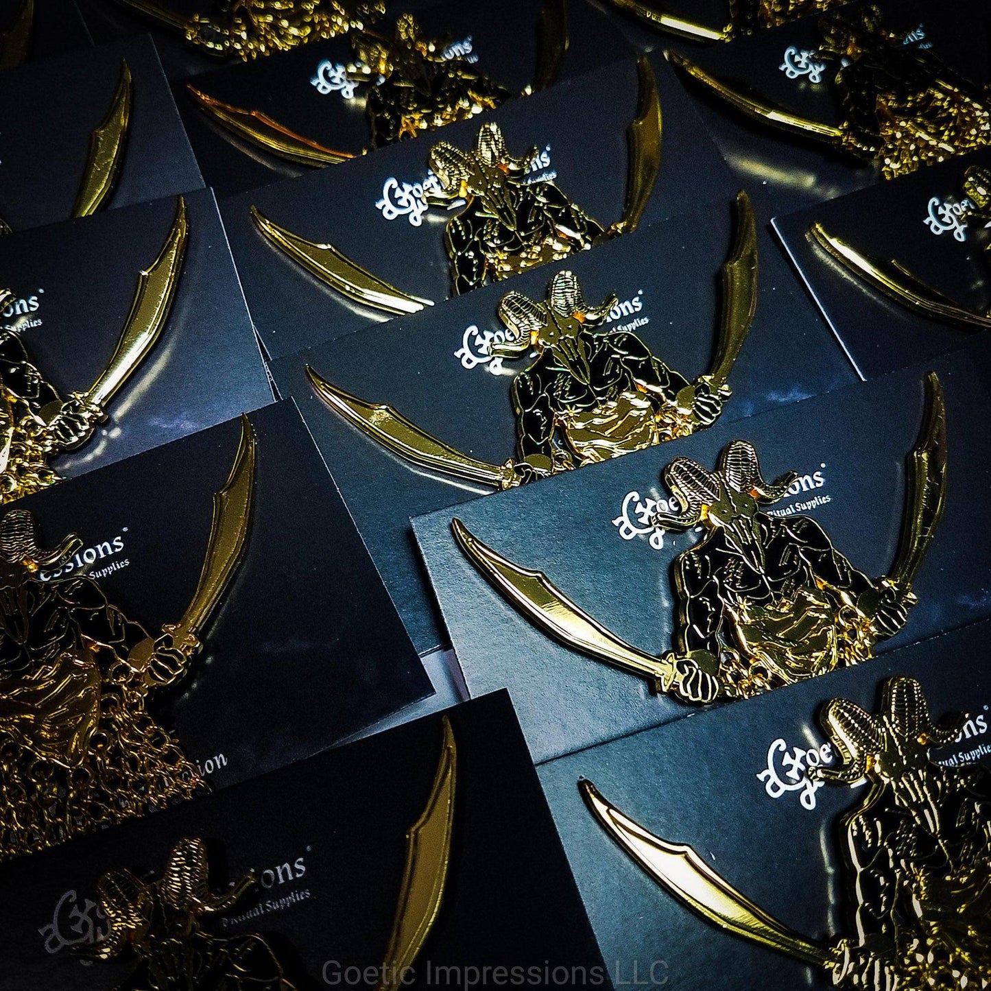 A series of several Azazel pins on card backs ready to be shipped.