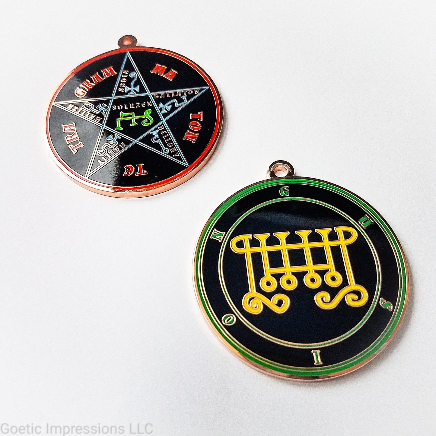 Two copper plated medallions featuring the front and back of the Ars Goetia spirit Gusion. The sigil is yellow with the name and circle surrounding in green. The Reverse is the TETRAGRAMMATON. The pentacle is blue with a red circle. Tetragrammaton is in red. The center sigil is green.