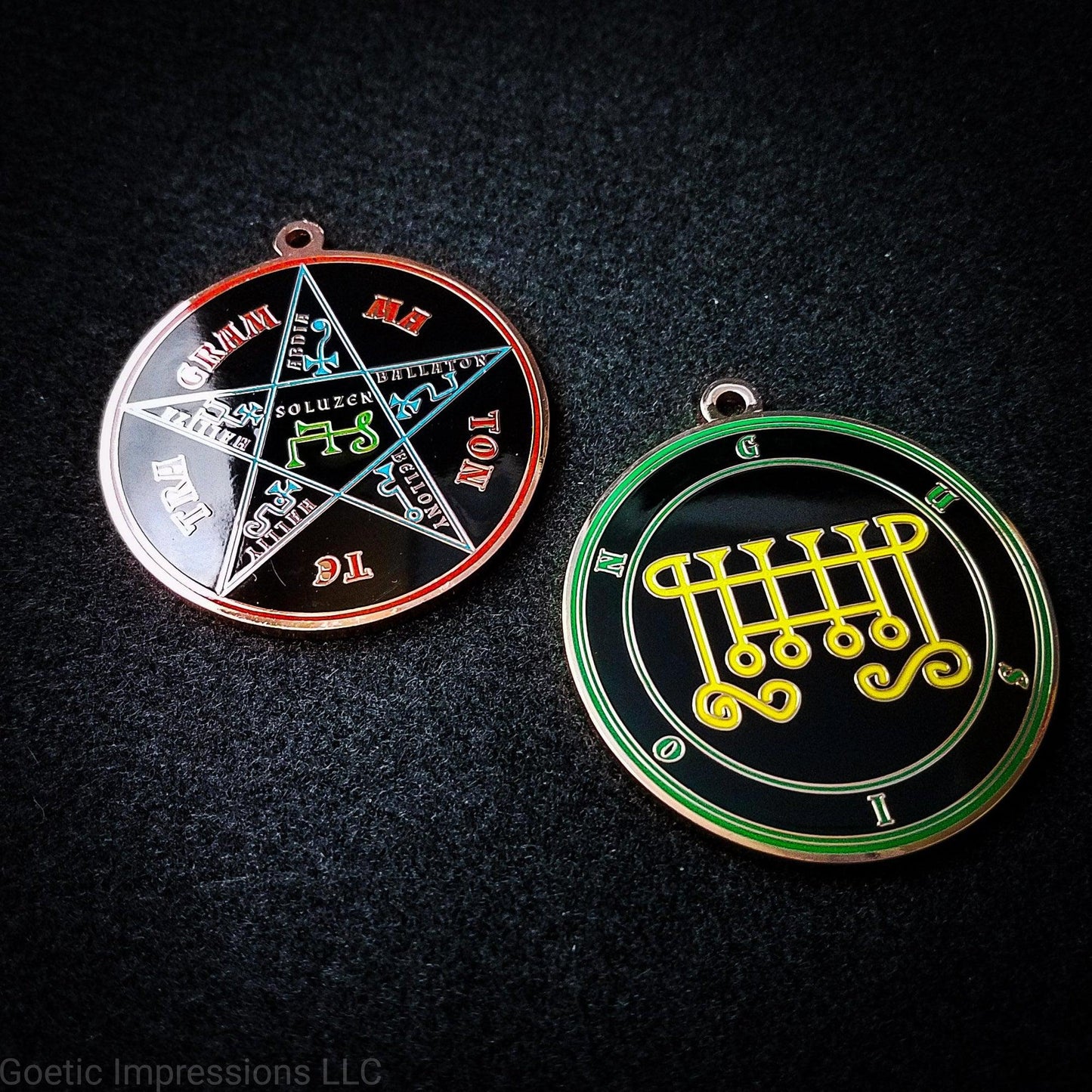 Two copper plated medallions featuring the front and back of the Ars Goetia spirit Gusion. The sigil is yellow with the name and circle surrounding in green. The Reverse is the TETRAGRAMMATON. The pentacle is blue with a red circle. Tetragrammaton is in red. The center sigil is green.