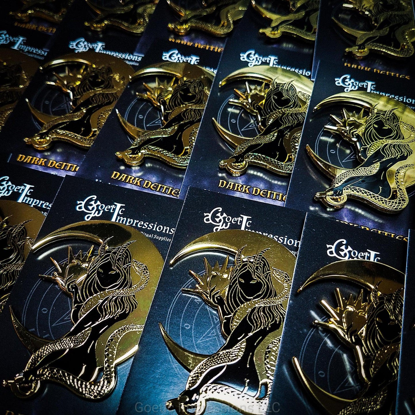 Multiple Lilith hard enamel pins ready to be packed up for orders.