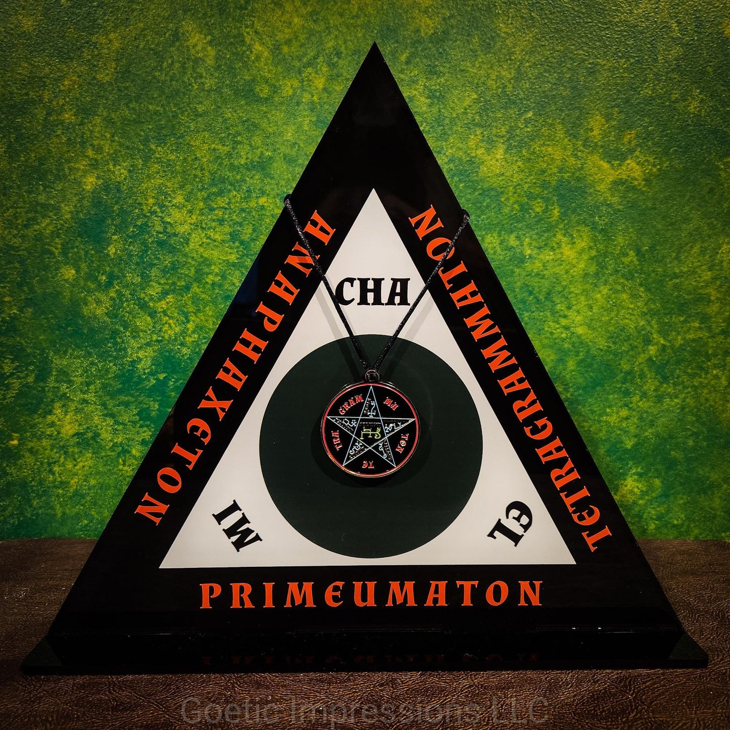 The Magickal Triangle of Solomon in full color with a Goetic necklace hanging in the center.