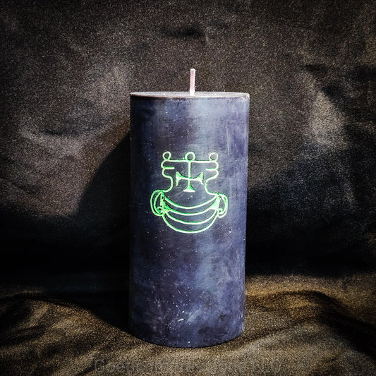 A black 3"x6" pillar candle with a hand carved green sigil of Agares from the Lesser Key of Solomon.