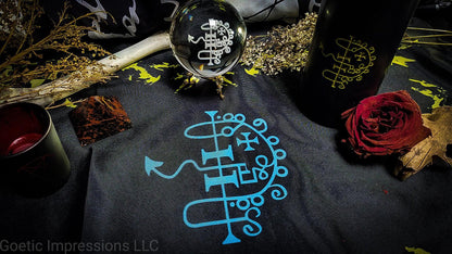 Asmodeus altar setup featuring candle, crystal ball and altar cloth