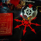 Thelemic Altar featuring Babalon Sigil Crystal ball, book of  the law and a chaos star altar cloth