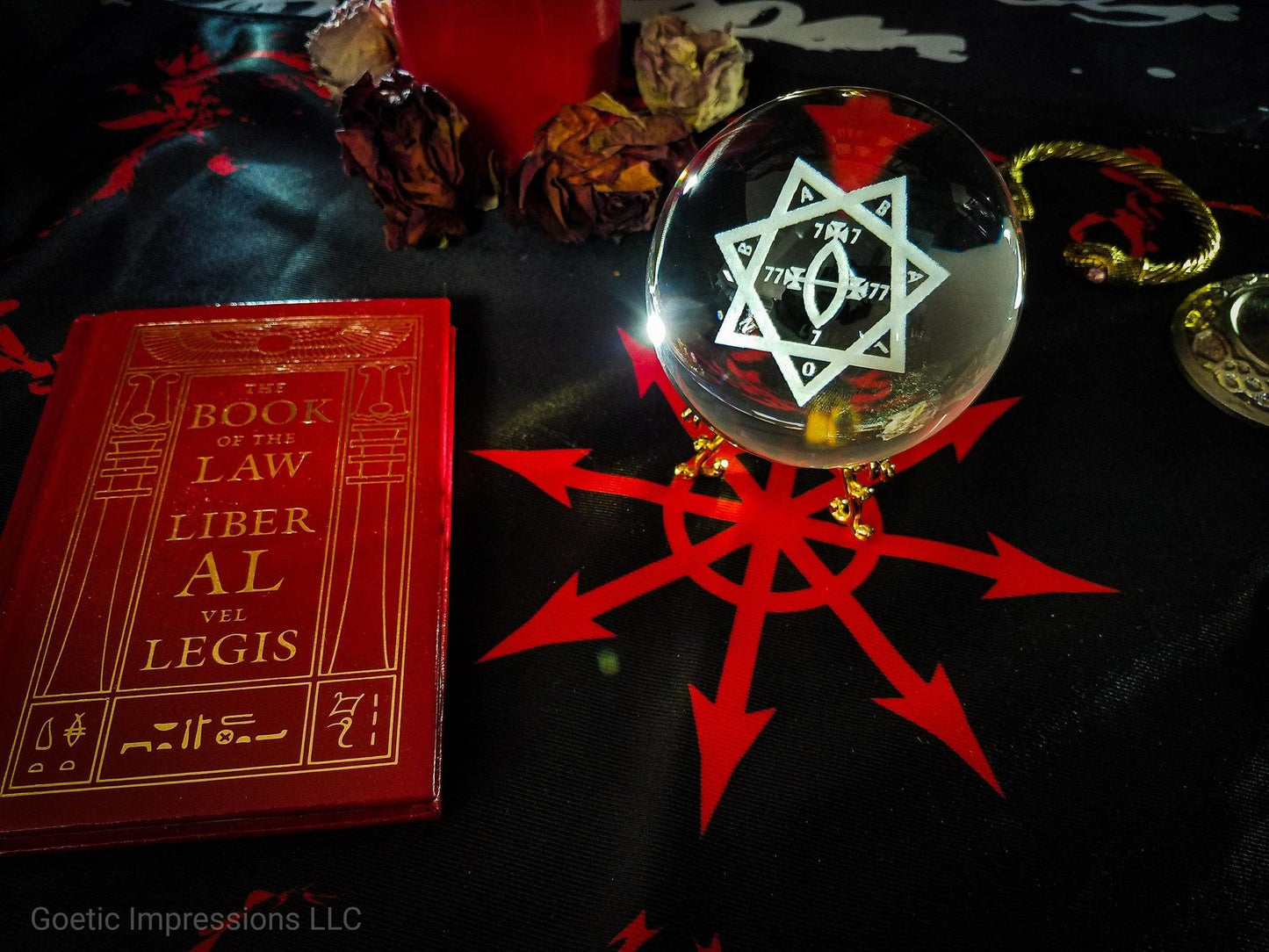 Thelemic Altar featuring Babalon Sigil Crystal ball, book of  the law and a chaos star altar cloth