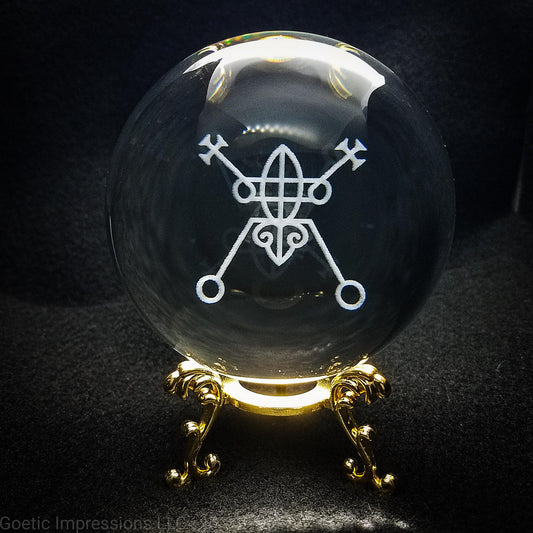 Crystal ball with Ars Goetia Bael sigil engraved into it
