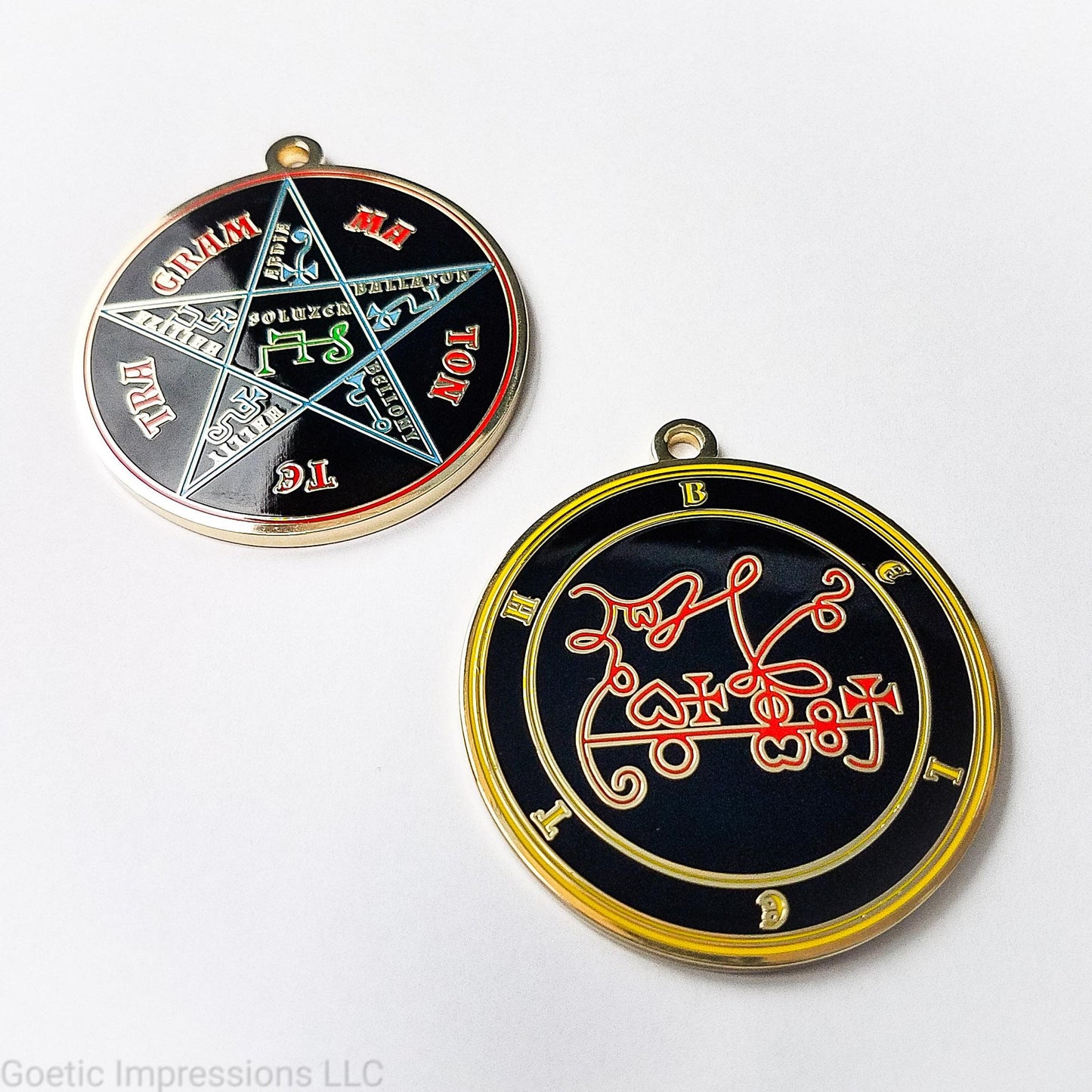 Two medallions featuring the front and back of the Ars Goetia spirit Beleth. The sigil is red with the name and circle surrounding in yellow. The Reverse is the TETRAGRAMMATON. The pentacle is blue with a red circle. Tetragrammaton is in red. The center sigil is green. The seal is plated in gold.