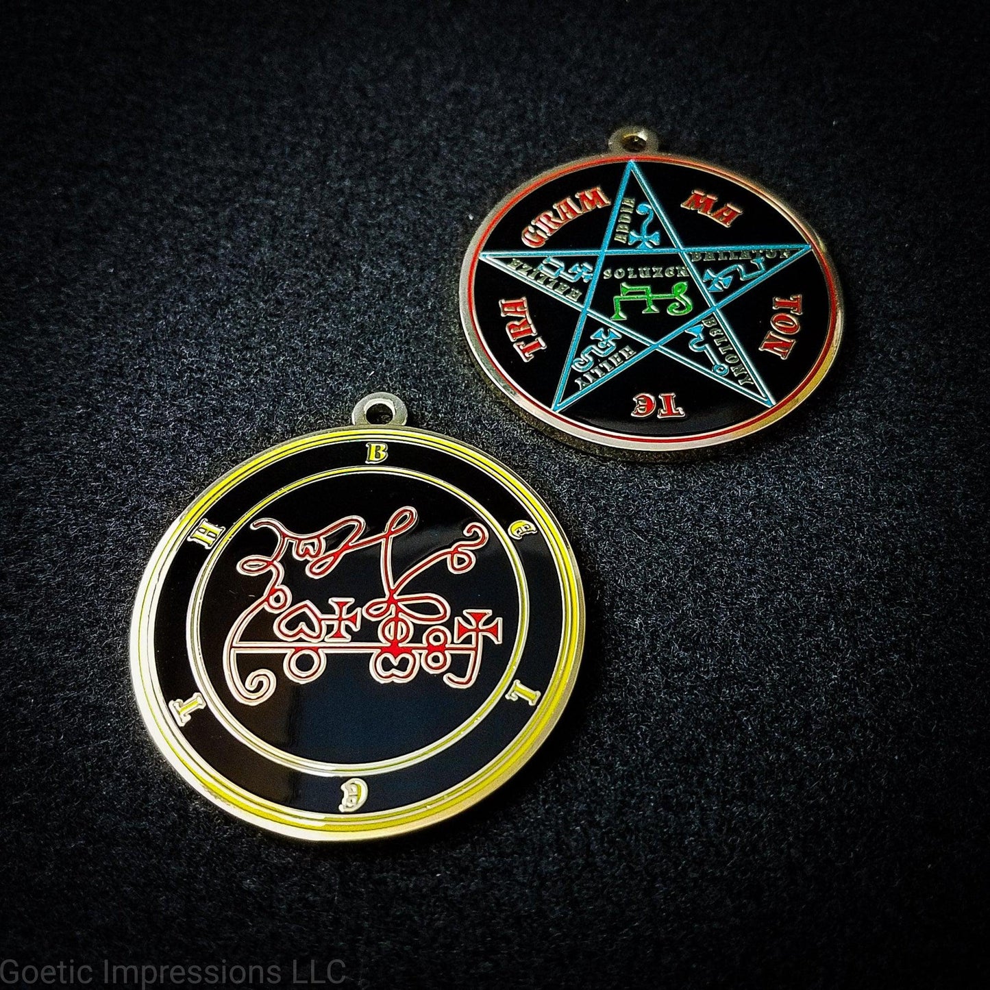 Two medallions featuring the front and back of the Ars Goetia spirit Beleth. The sigil is red with the name and circle surrounding in yellow. The Reverse is the TETRAGRAMMATON. The pentacle is blue with a red circle. Tetragrammaton is in red. The center sigil is green. The seal is plated in gold.