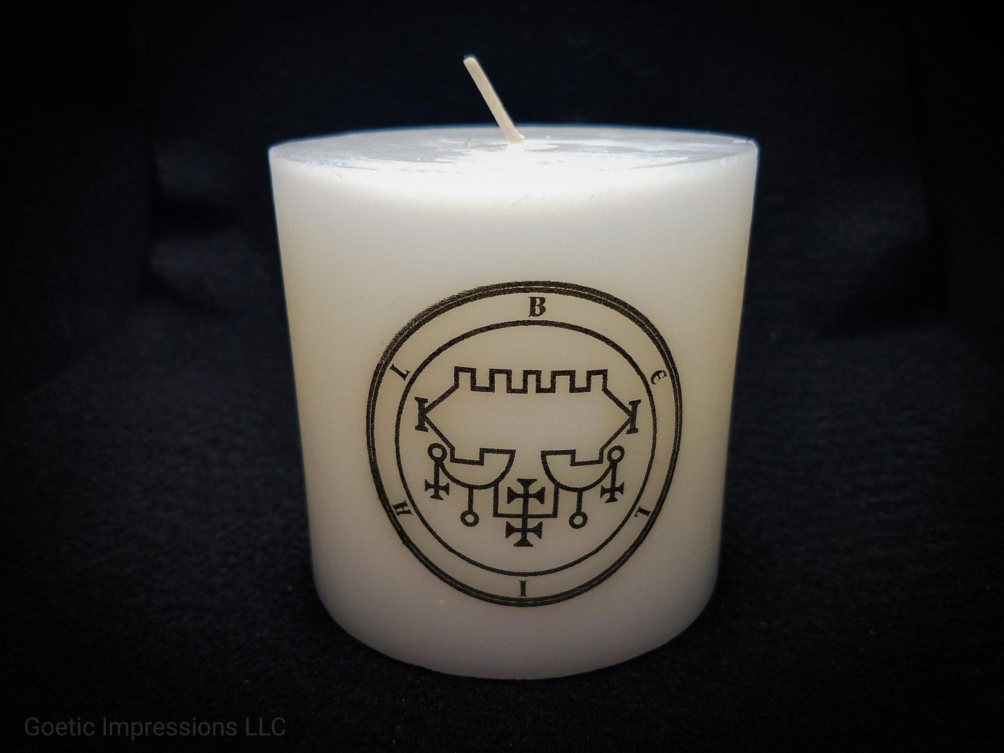 Black and white Belial seal on white pillar candle