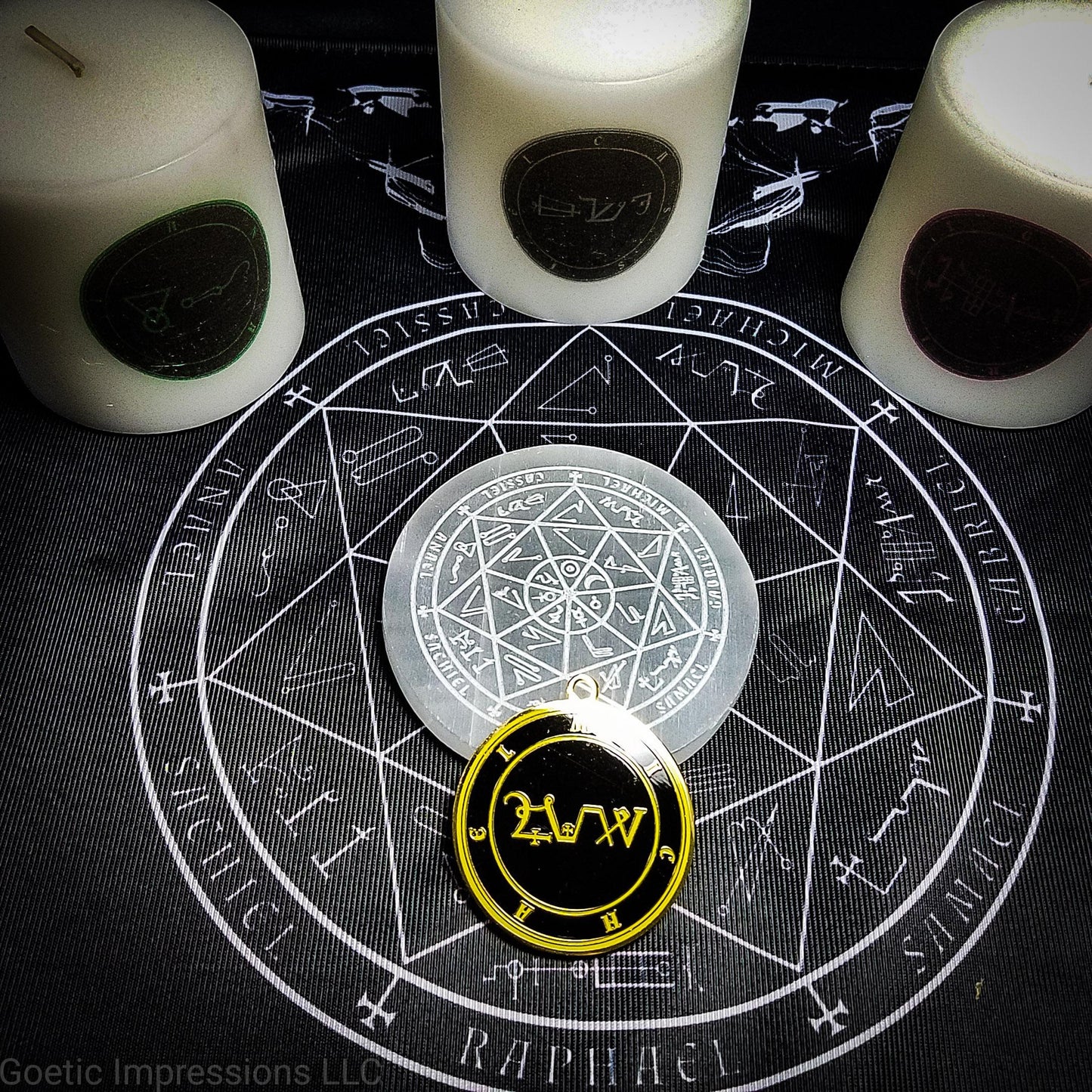 A black and white altar cloth with a seal of the planetary Archangels in the center. The seal contains various astrological sigils. Various ritual tools are on the cloth.