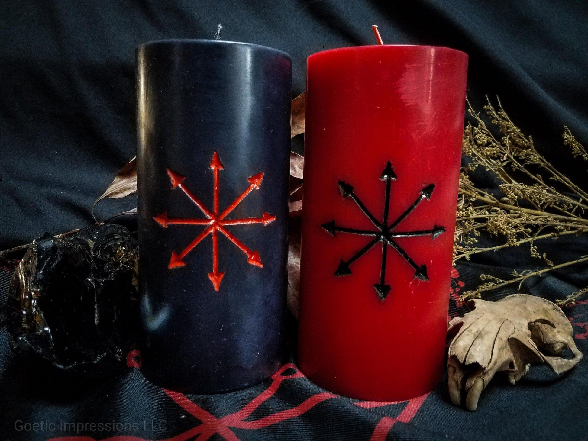 Pillar candles with Chaos Star carved into it.