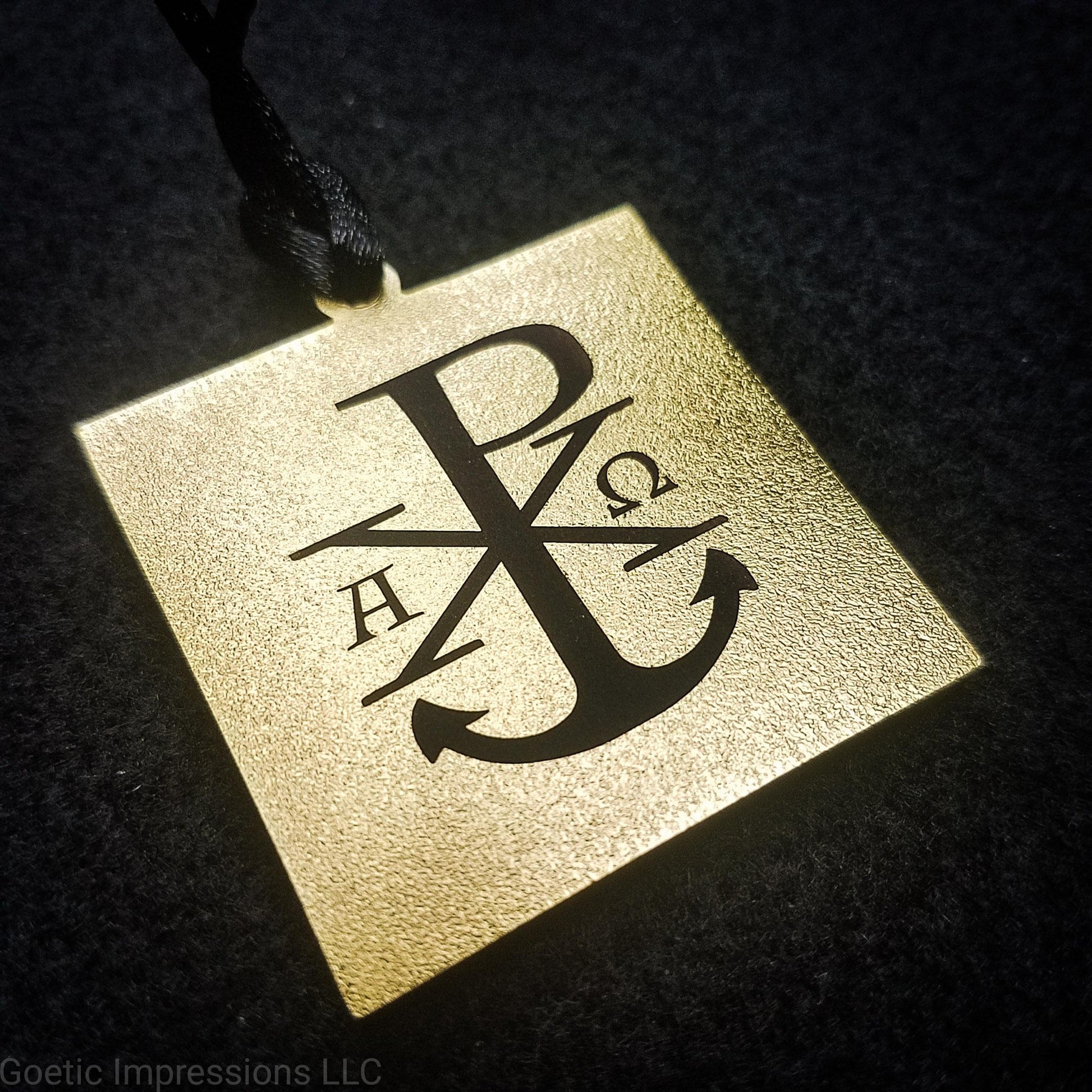 Chi Rho symbol with Alpha and Omega on a talisman