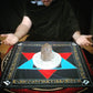Altar cloth of the holy table of practice used in Enochian magic with wax sigillum and quartz crystal