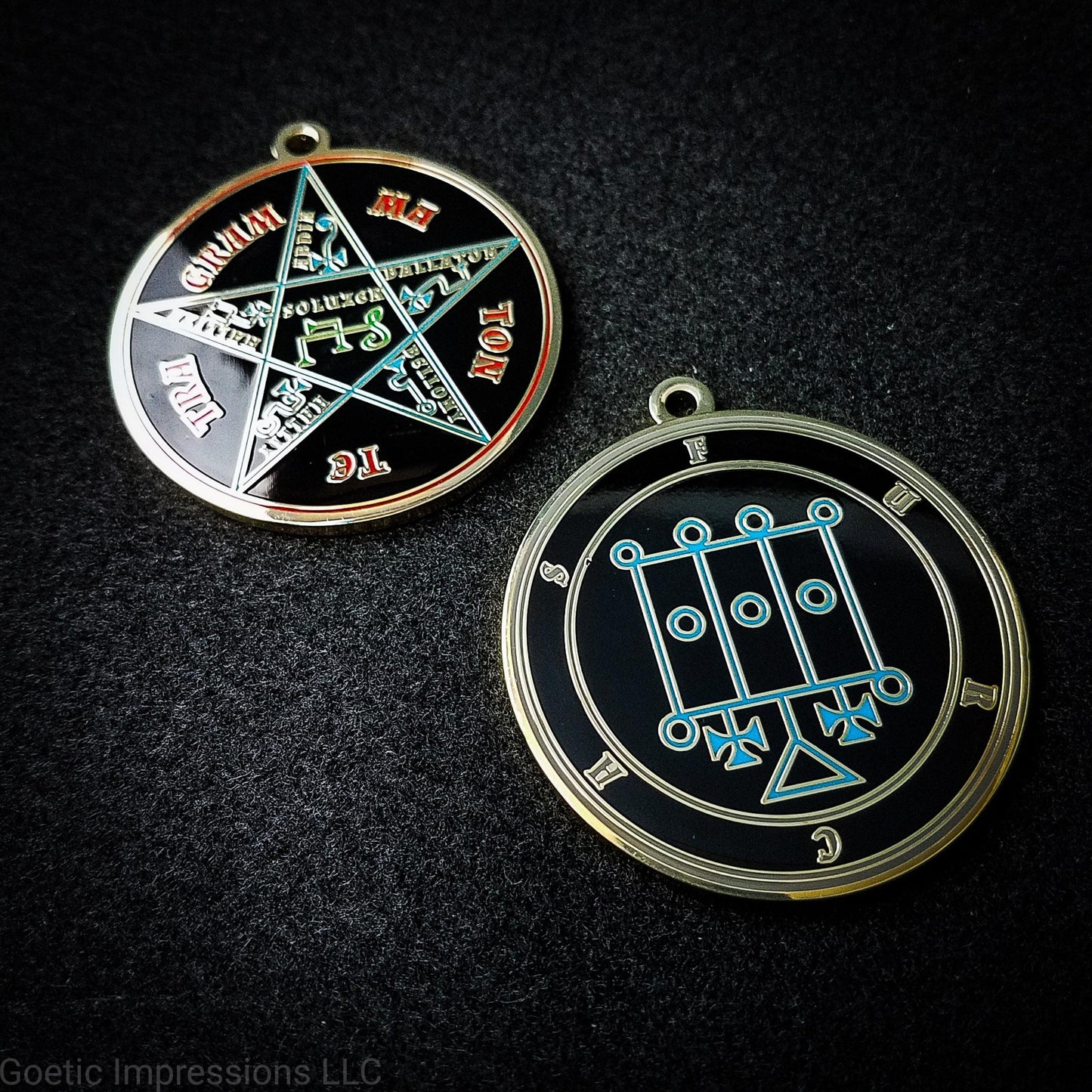 Two medallions featuring the front and back of the Ars Goetia spirit Furcas. The sigil is blue with the name and circle surrounding in grey. The Reverse is the TETRAGRAMMATON. The pentacle is blue with a red circle. Tetragrammaton is in red. The center sigil is green. The seal is plated in brass.