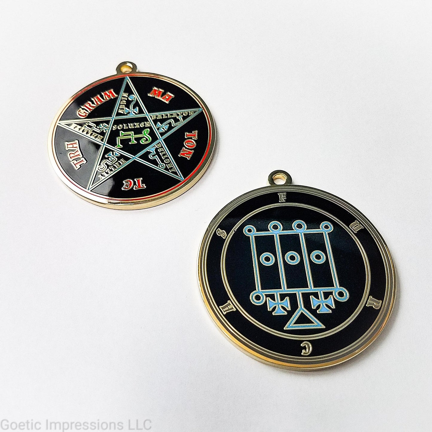 Two medallions featuring the front and back of the Ars Goetia spirit Furcas. The sigil is blue with the name and circle surrounding in grey. The Reverse is the TETRAGRAMMATON. The pentacle is blue with a red circle. Tetragrammaton is in red. The center sigil is green. The seal is plated in brass.