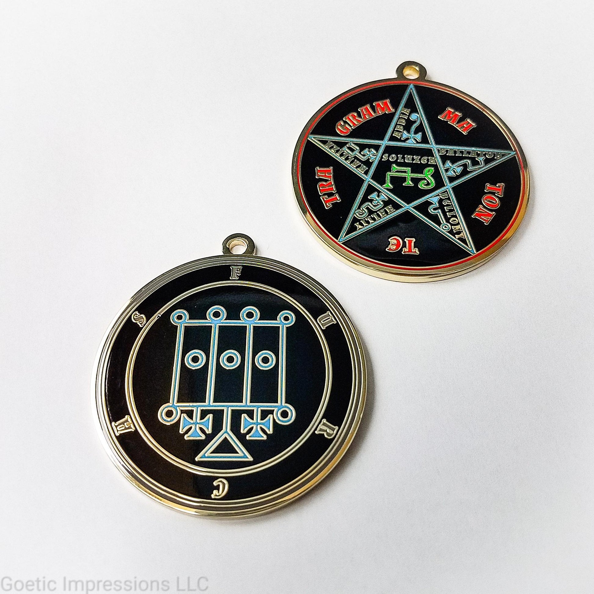 Two medallions featuring the front and back of the Ars Goetia spirit Furcas. The sigil is blue with the name and circle surrounding in grey. The Reverse is the TETRAGRAMMATON. The pentacle is blue with a red circle. Tetragrammaton is in red. The center sigil is green. The seal is plated in brass.