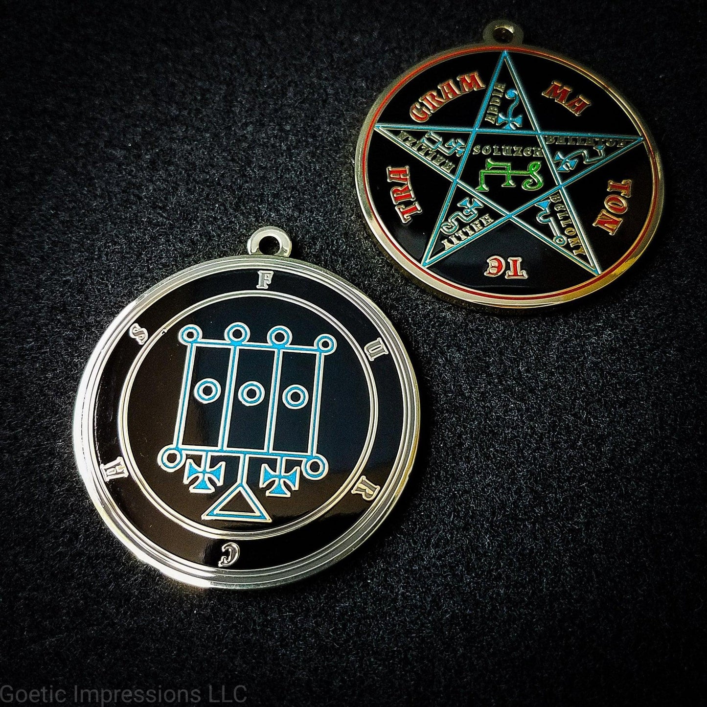 Two medallions featuring the front and back of the Ars Goetia spirit Furcas. The sigil is blue with the name and circle surrounding in grey. The Reverse is the TETRAGRAMMATON. The pentacle is blue with a red circle. Tetragrammaton is in red. The center sigil is green. The seal is plated in brass.