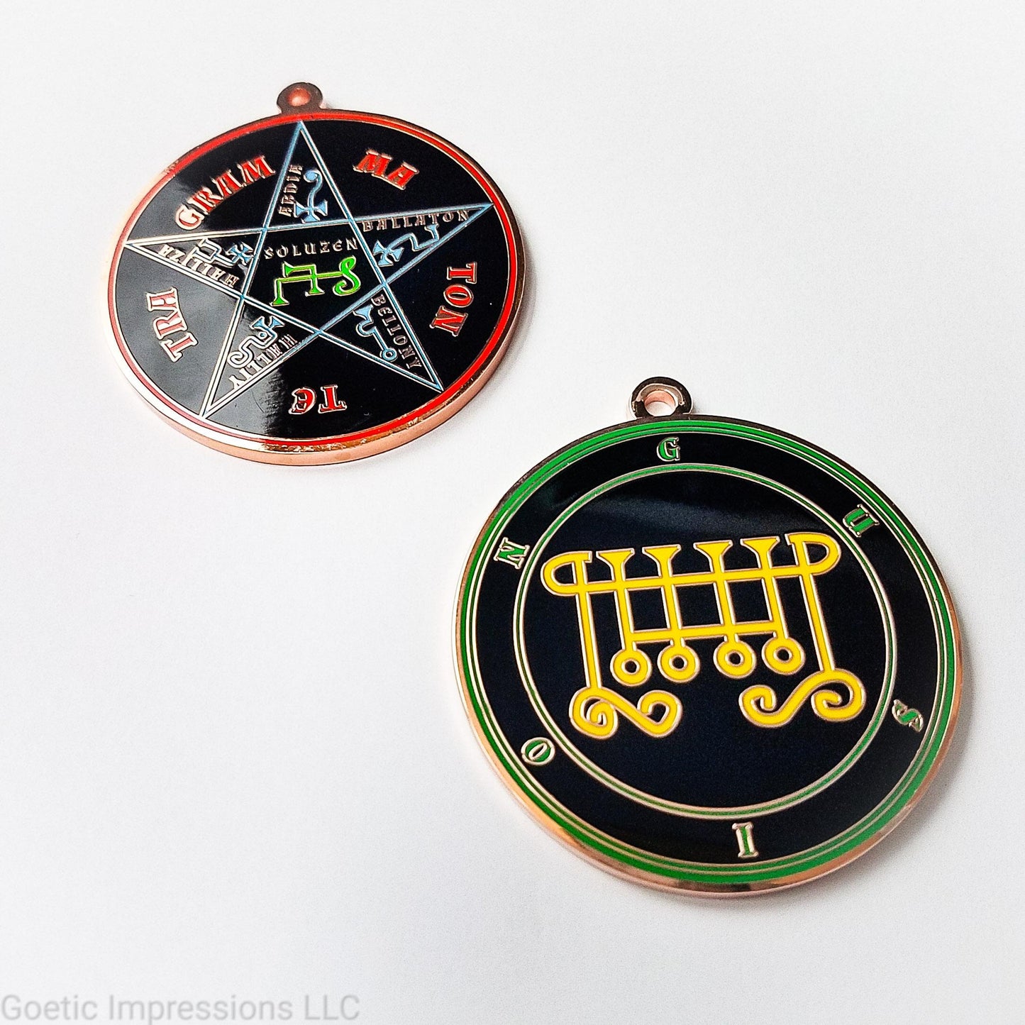 Two copper plated medallions featuring the front and back of the Ars Goetia spirit Gusion. The sigil is yellow with the name and circle surrounding in green. The Reverse is the TETRAGRAMMATON. The pentacle is blue with a red circle. Tetragrammaton is in red. The center sigil is green. 