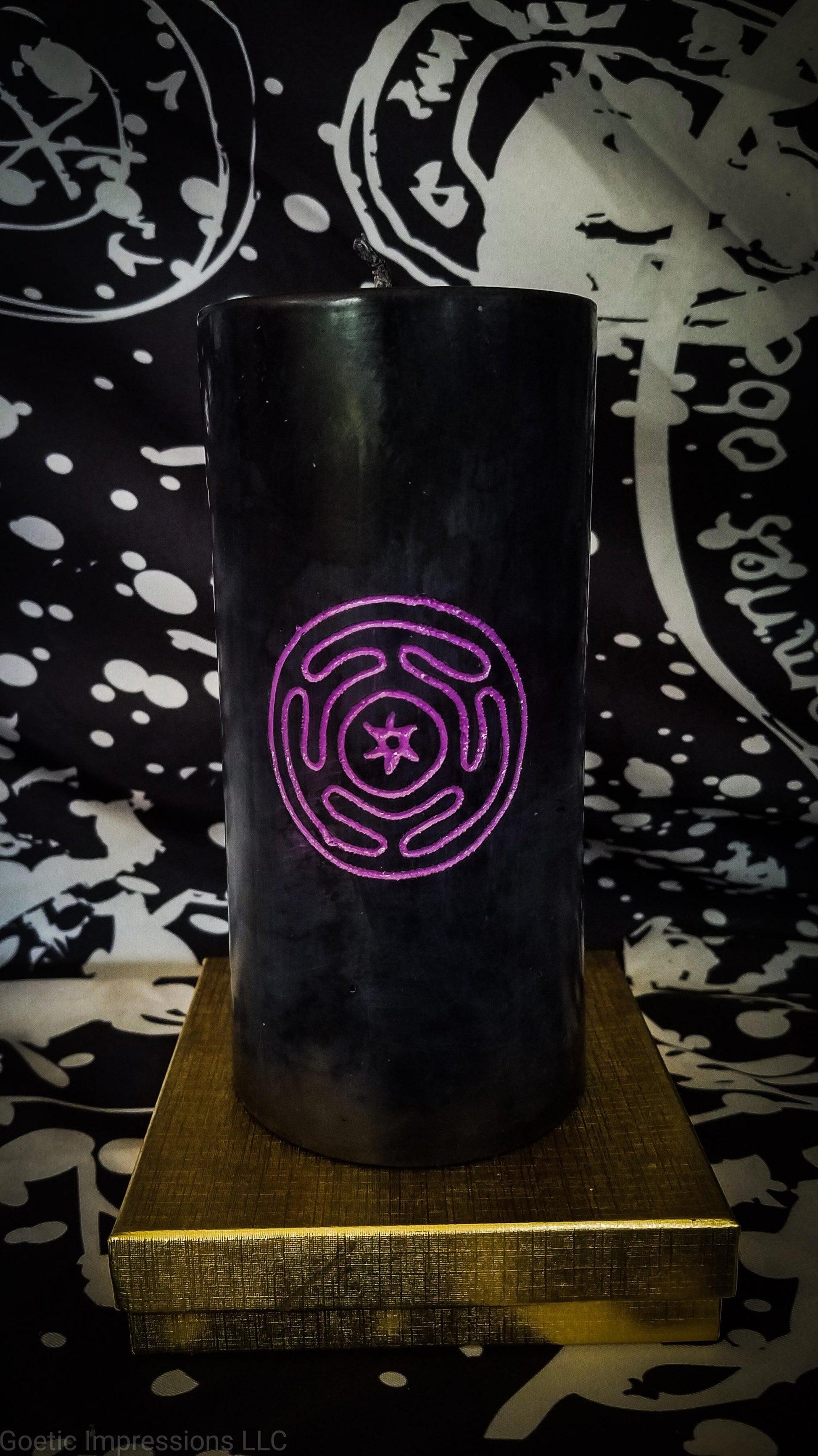 Hand carved black pillar candle with purple engraved Hecate sigil