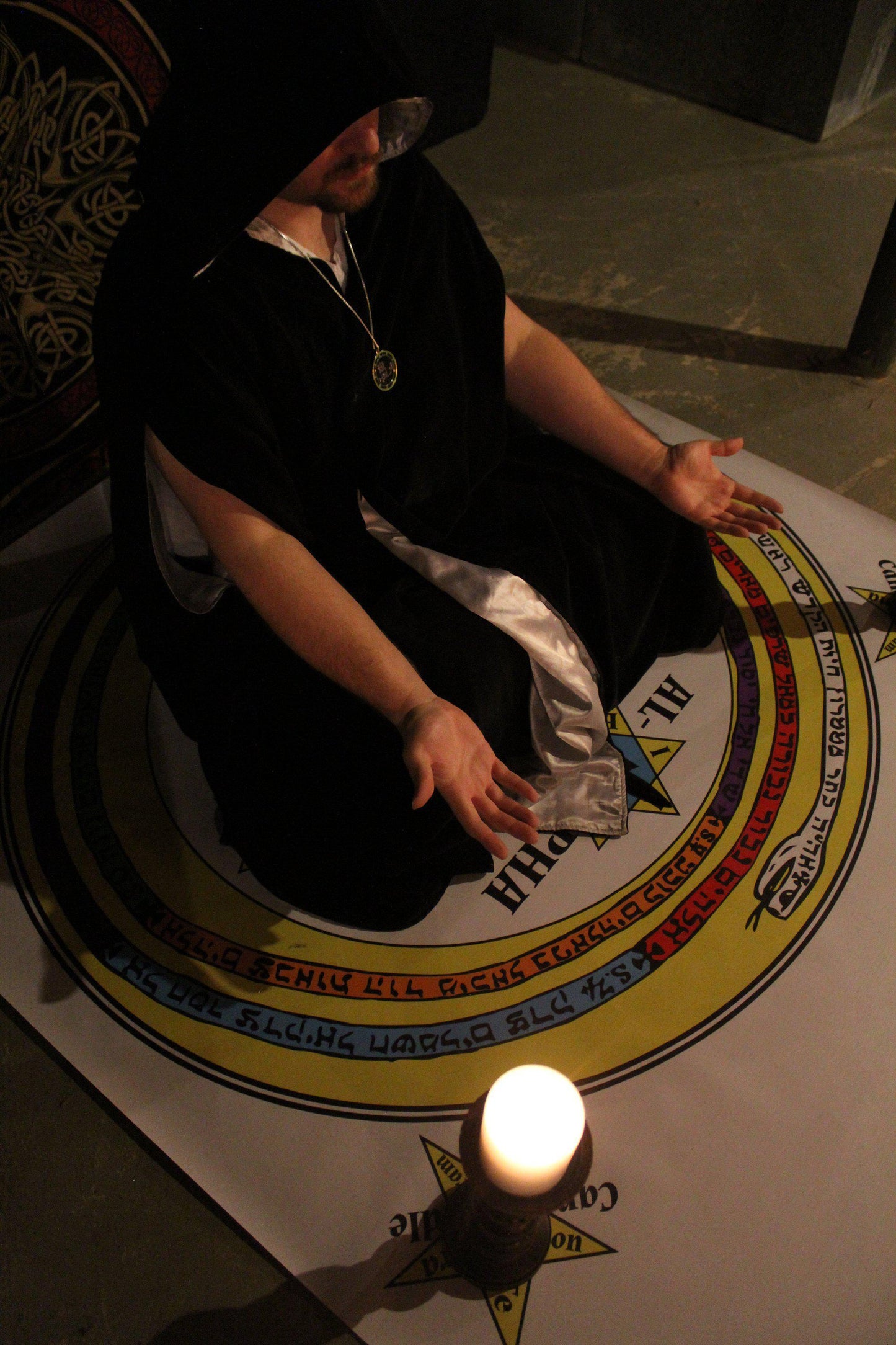 Magician meditating in a circle of solomon with a dantallion medallion