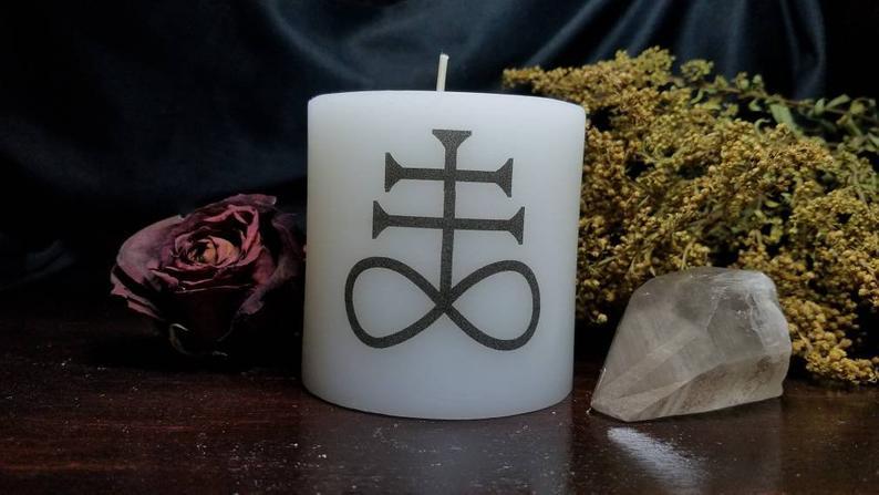 Leviathan cross on a white pillar candle