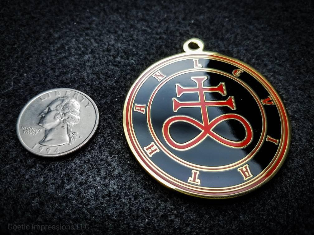 Black and  red Leviathan sigil medallion with gold plating.