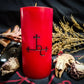 Red pillar candle with black Lilith sigil carved into it.