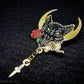 Lupercalia pin featuring a black wolf with a crescent moon in the background. The wolf is holding a rose, leather strips and has a chain with a dagger attached to it. It is plated in gold.