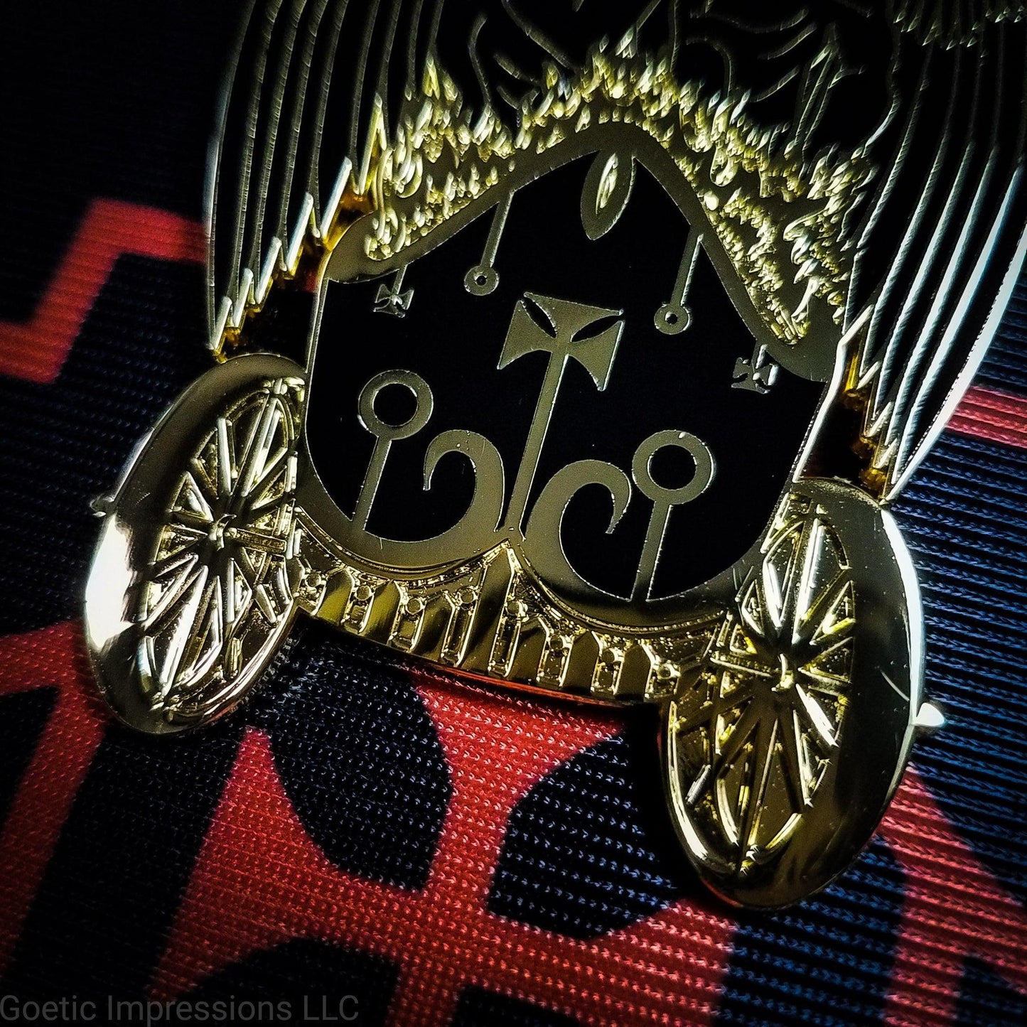 Close up of a black and gold Belial pin.