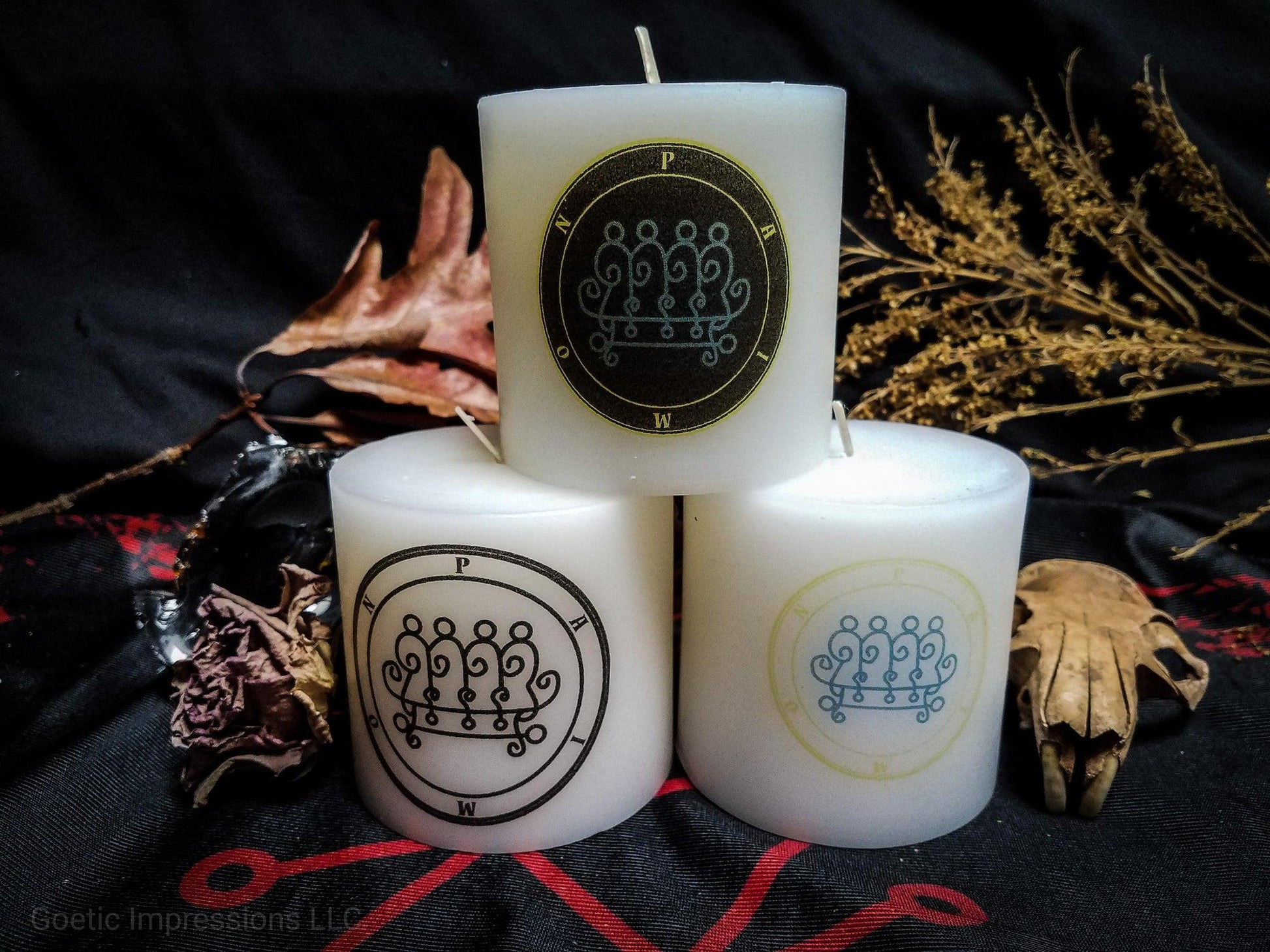 White pillar candles featuring sigil and seal of Paimon