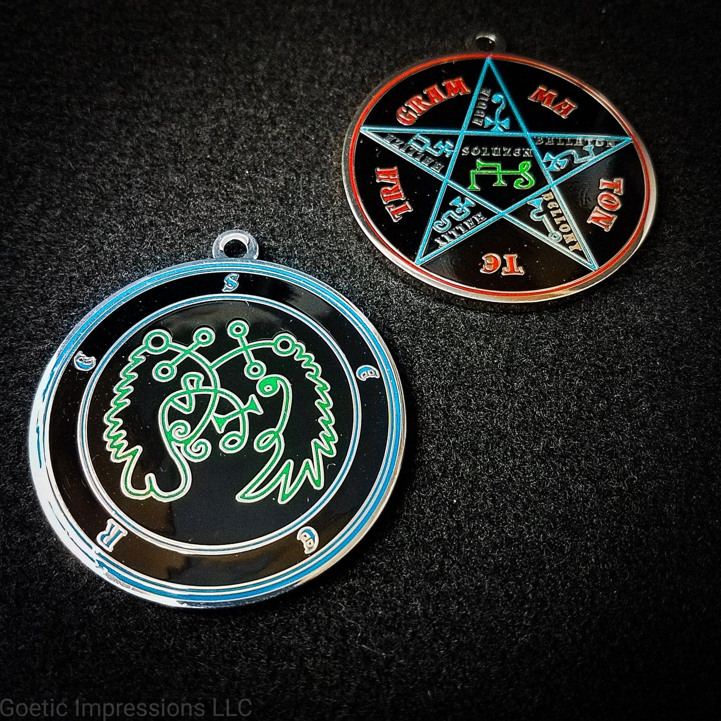 Two medallions featuring the front and back of the Ars Goetia spirit Seere. The sigil is green with the name and circle surrounding in blue.  The Reverse is the TETRAGRAMMATON.  The pentacle is blue with a red circle.  Tetragrammaton is in red. The center sigil is green. The seal is plated in silver.