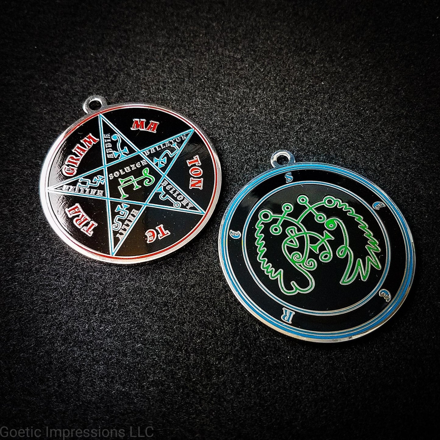 Two medallions featuring the front and back of the Ars Goetia spirit Seere. The sigil is green with the name and circle surrounding in blue.  The Reverse is the TETRAGRAMMATON.  The pentacle is blue with a red circle.  Tetragrammaton is in red. The center sigil is green. The seal is plated in silver.