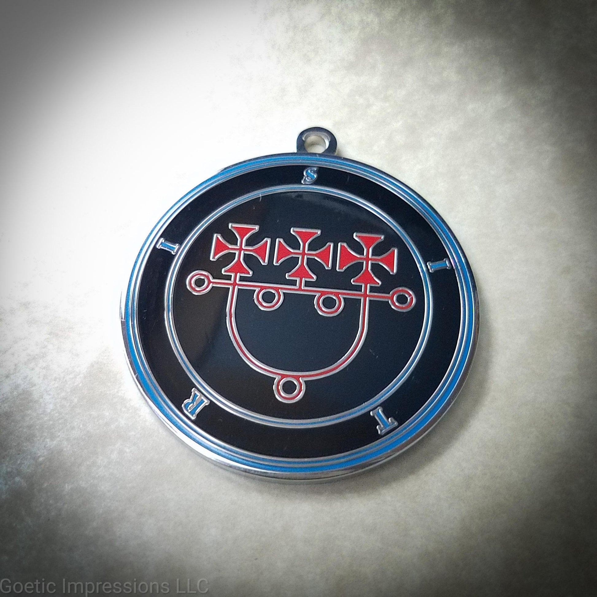 Talisman of the goetic spirit Sitri. The sigil is red on a black background and the text and circles are in blue.