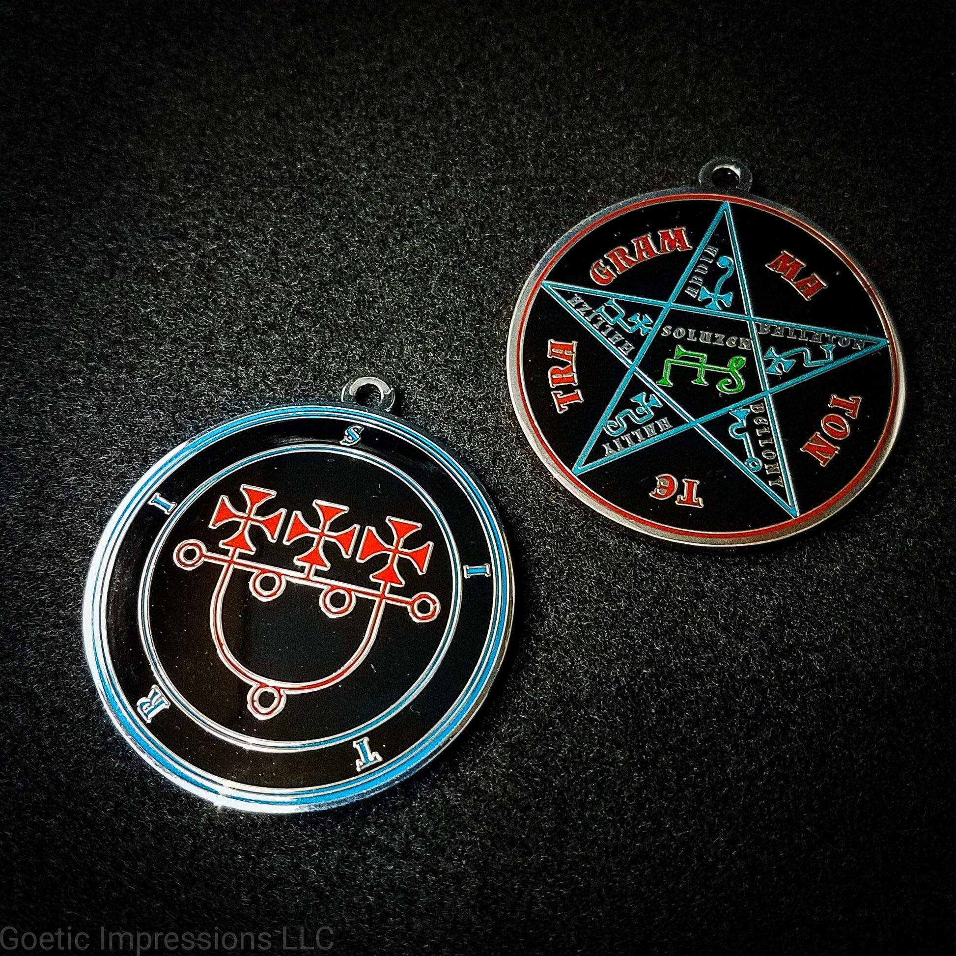 Two medallions showing the front and reverse side of the Goetic Spirit Sitri. The circles and text for Sitri is colored in blue with the sigil in red on a black background. The reverse side is the Pentacle of Solomon with TETRAGRAMMATON text in red, the star and sigils in blue and the center sigil in green. The seal is silver plated.