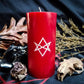 Red pillar candle with white unicursal hexagram sigil carved into it.