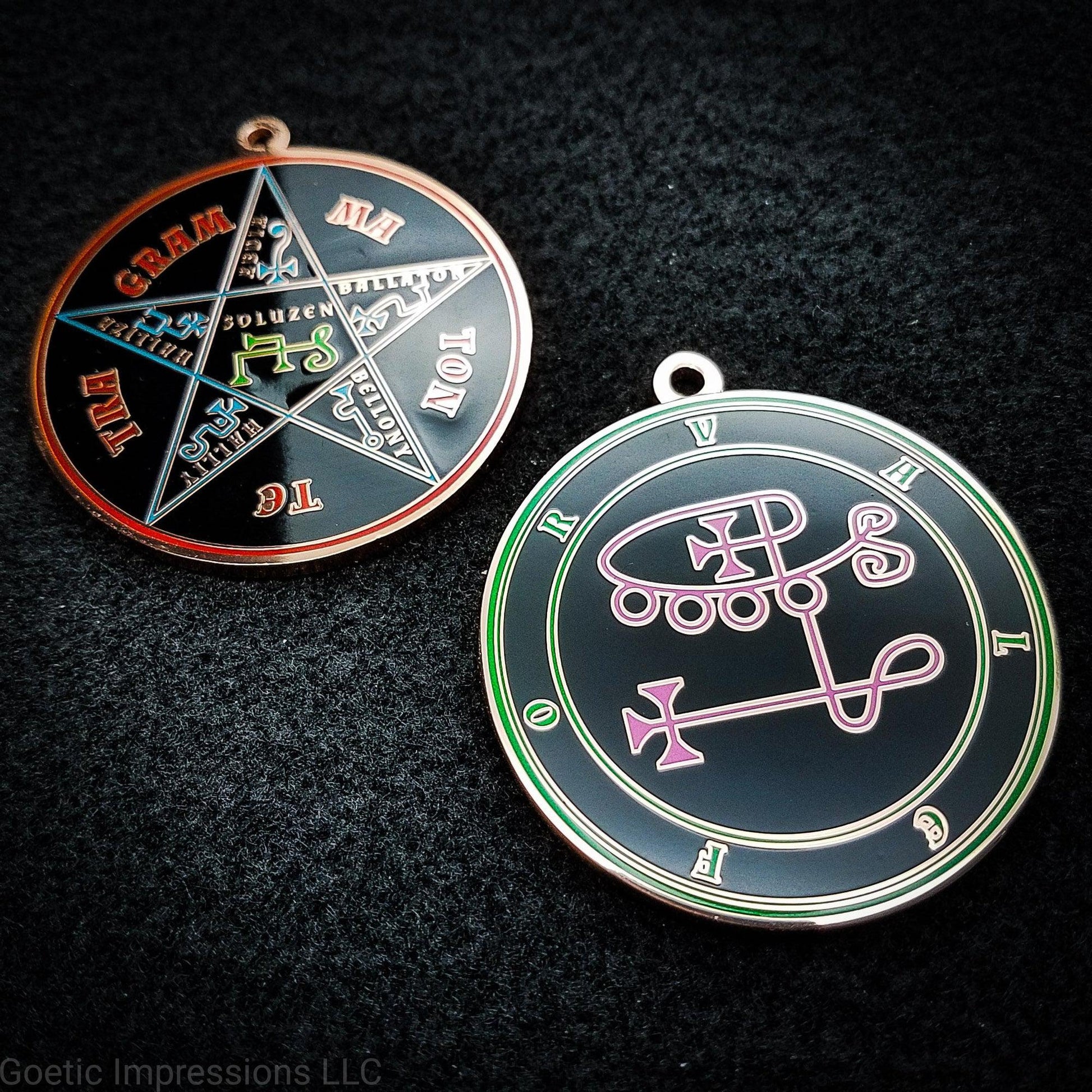 Two medallions featuring the front and back of a ritual accurate medallion for Valefor. Valefor's sigil is pink with consenctric circles and name in green around the sigil. On the back is the Pentacle of Solomon featuring the Tetragrammaton and associated colors.