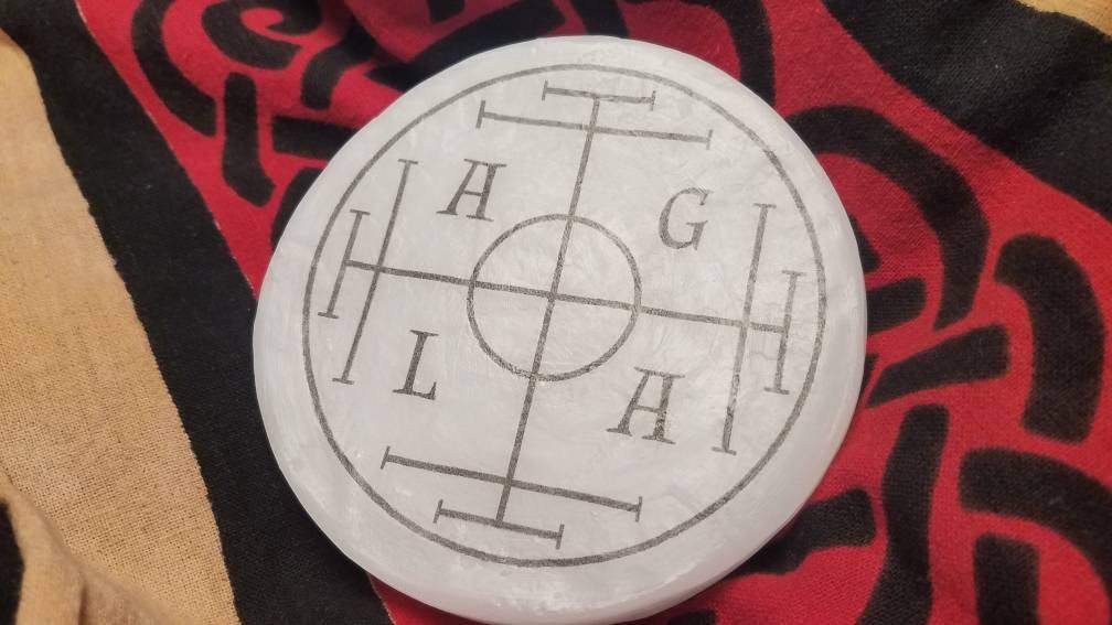 Back side of the wax Sigillum Dei Aemeth featuring AGLA.